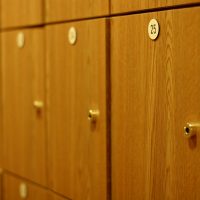 Sequentially numbered wooden lockers in a gym